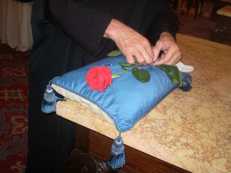 the rose is fixed to the altar cushion